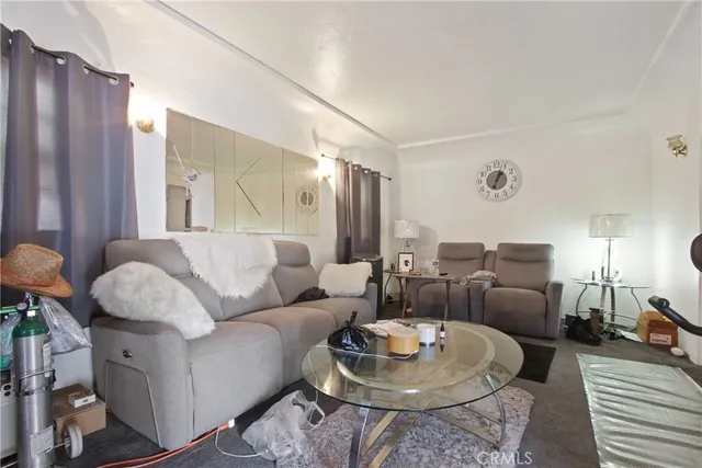 a living room with furniture and a table