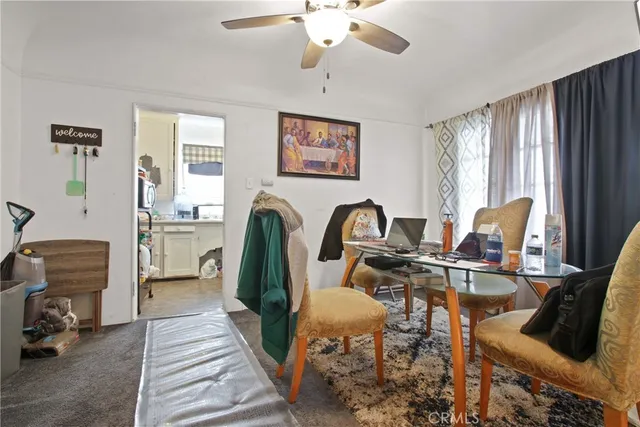 a view of a livingroom with furniture and windows