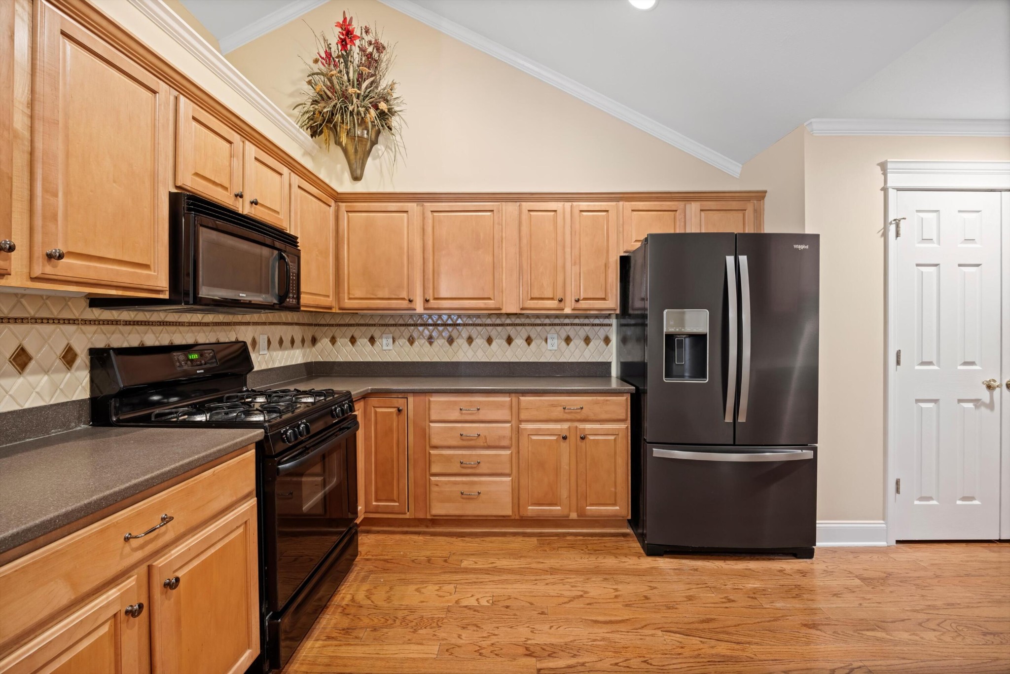 2457 Baskette Way Chattanooga, TN 37421 - Photo 13 of 24 a kitchen with stainless steel appliances granite countertop a refrigerator stove and sink