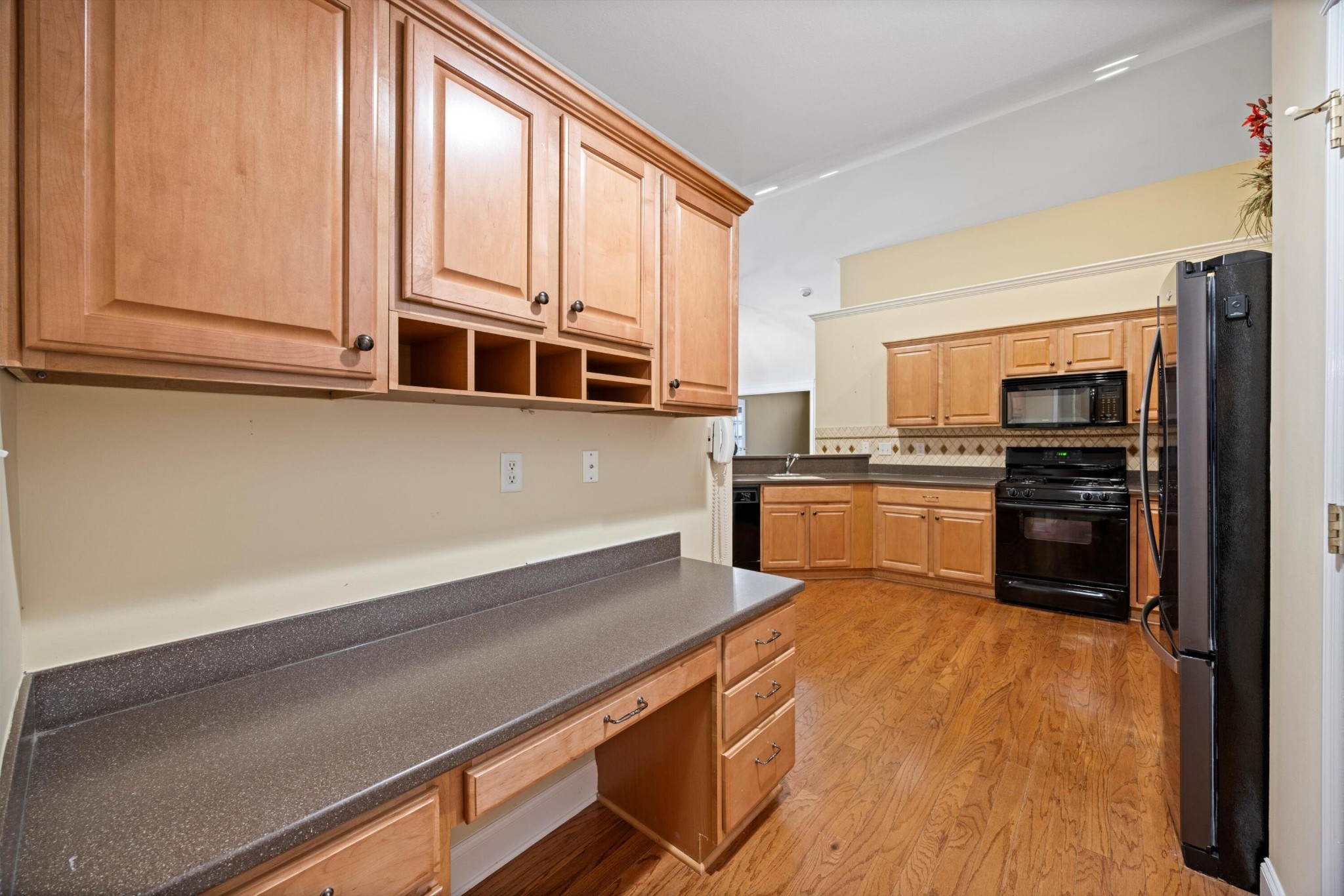 2457 Baskette Way Chattanooga, TN 37421 - Photo 14 of 24 a kitchen with stainless steel appliances a stove sink and microwave