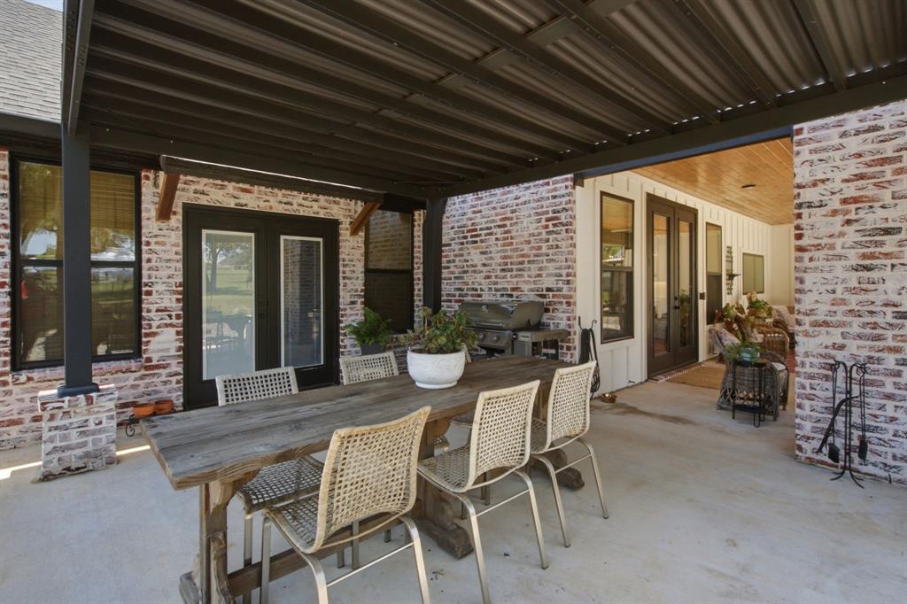 200 Greene Road Wilmer, TX 75172 - Photo 35 of 40 a dining room with furniture and outdoor view