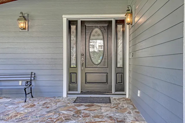 a living room with furniture a fireplace and a table