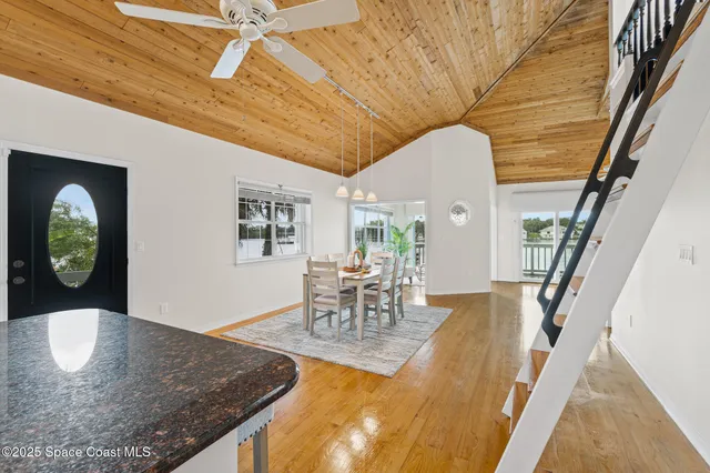 a living room with furniture and a painting