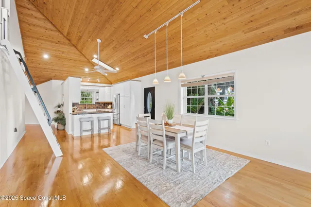 a kitchen with stainless steel appliances a stove a sink and a microwave