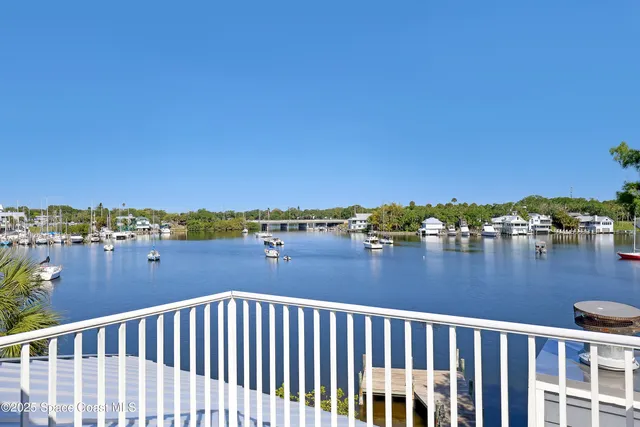 a view of a house with pool yard and lake view