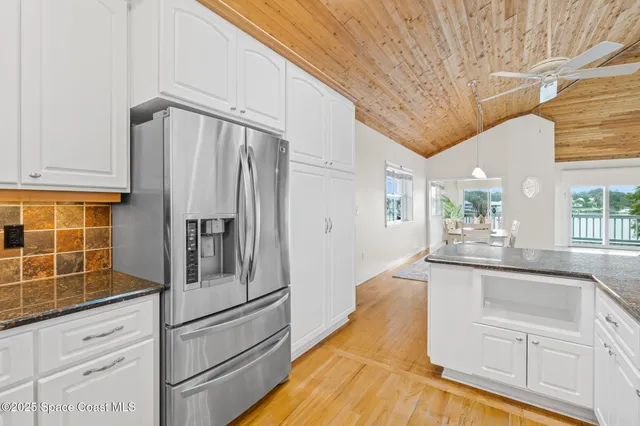 a bathroom with a sink toilet a mirror and shower