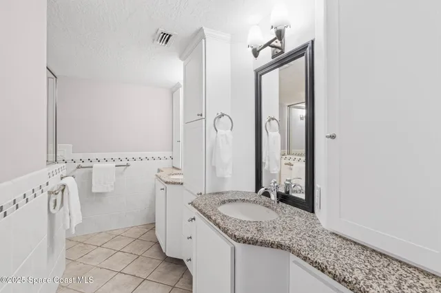 a view of a wooden fence with a bench