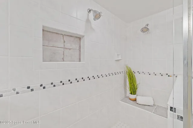 a view of a balcony with wooden floor and fence