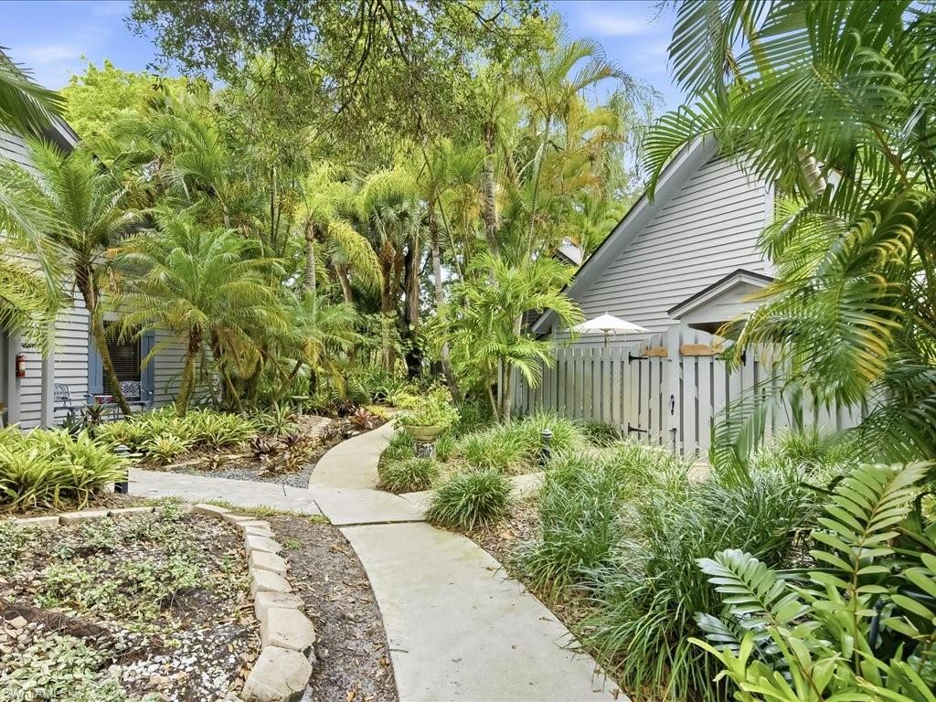 1337 Solana Road Naples, FL 34103 - Photo 1 of 23 Landscaped pathway walking to your front entrance