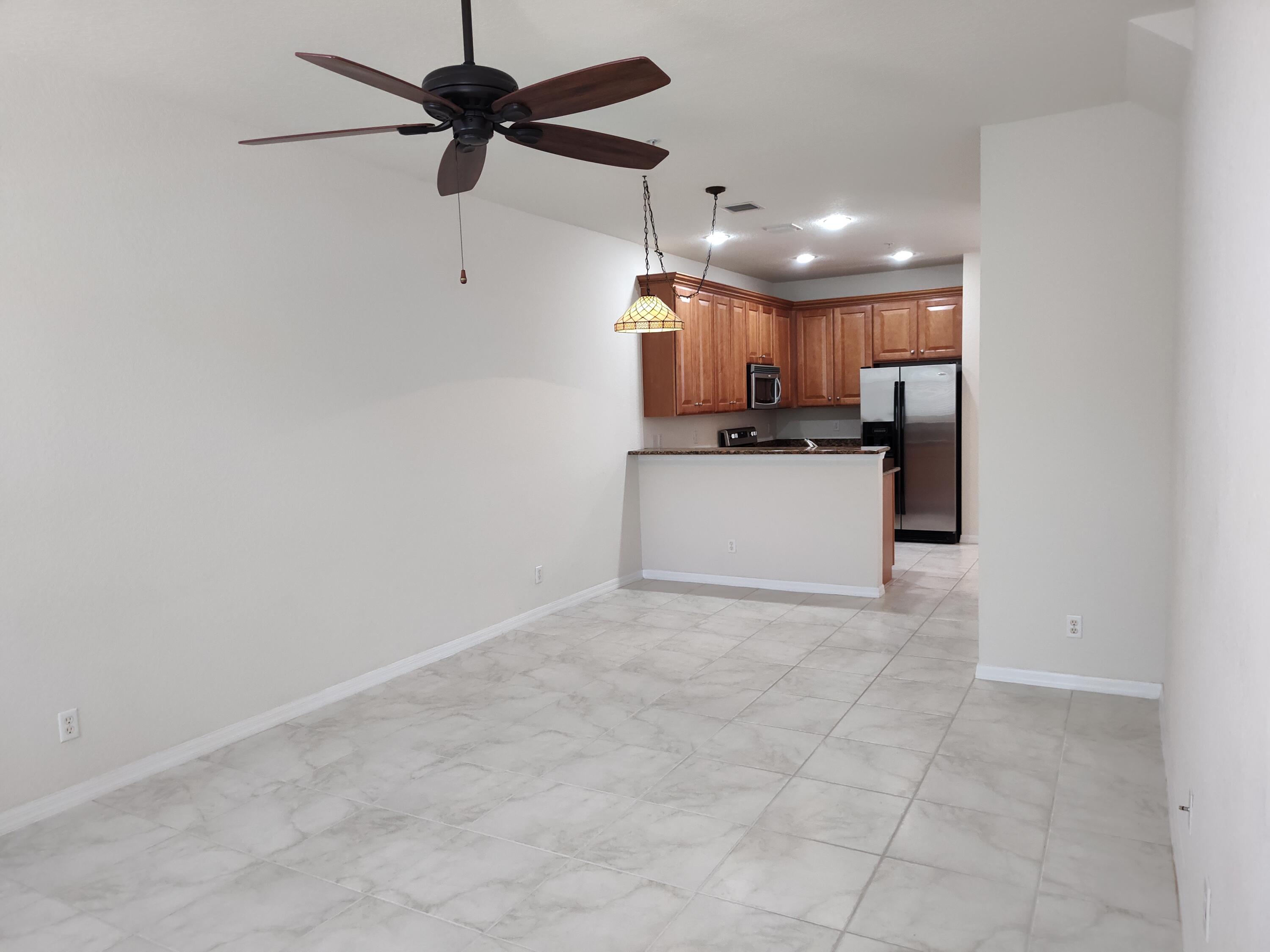 265 Indian Creek Parkway, Unit 102 Jupiter, FL 33458 - Photo 6 of 21 Living Room / Kitchen