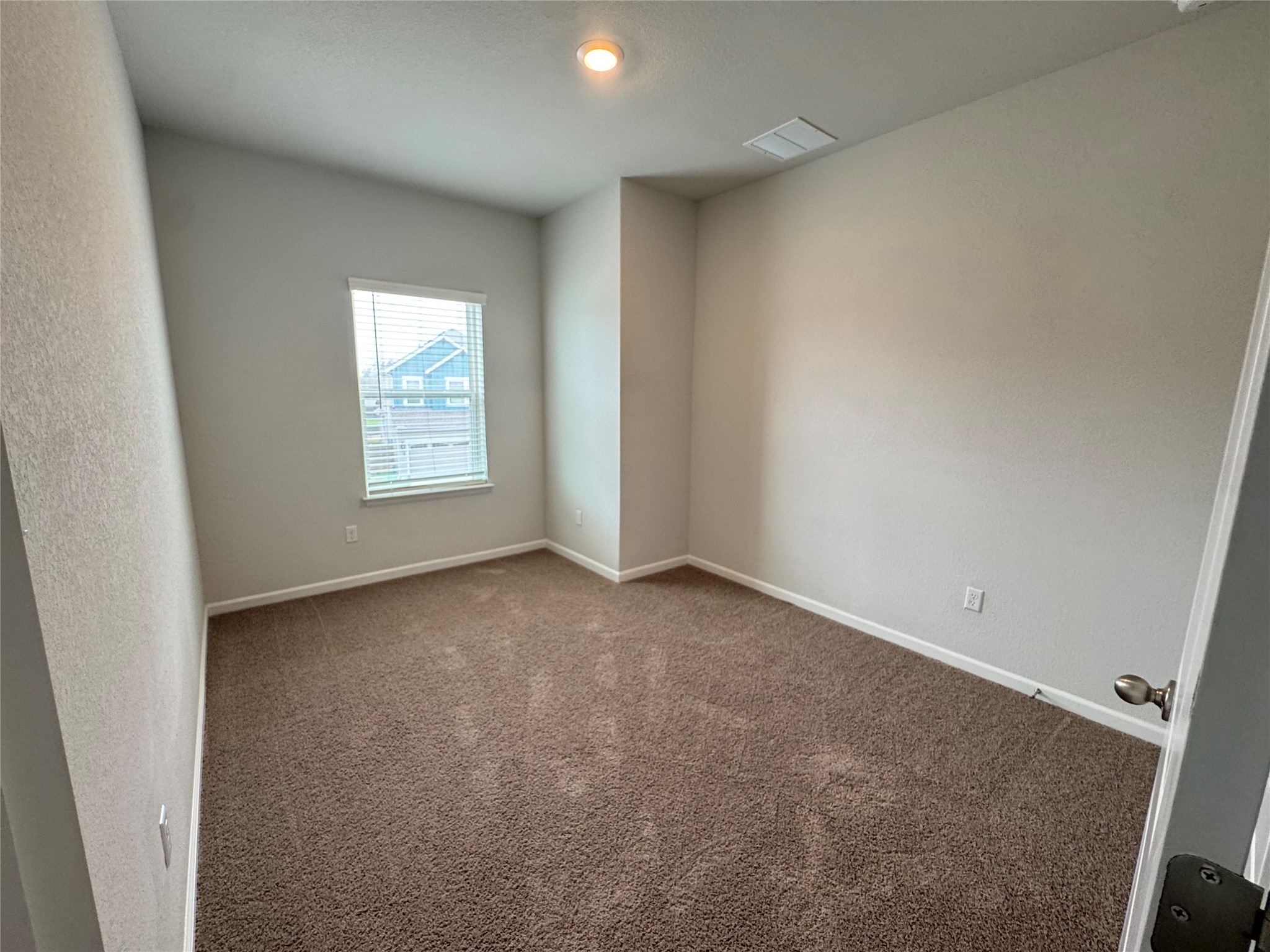 3000 Chisholm Trail Road, Unit 103 Round Rock, TX 78681 - Photo 24 of 32 Bedroom3 featuring dark carpet and baseboards