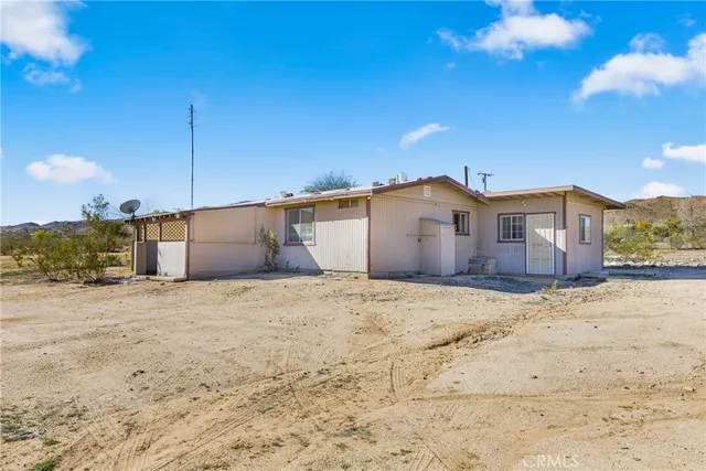 a view of a house with a snow in the yard