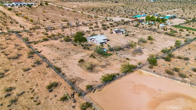 an aerial view of a yard with horses