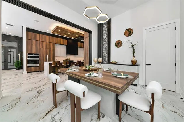 a view of a dining room with furniture window and outside view