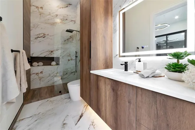 a bathroom with a double vanity sink and mirror