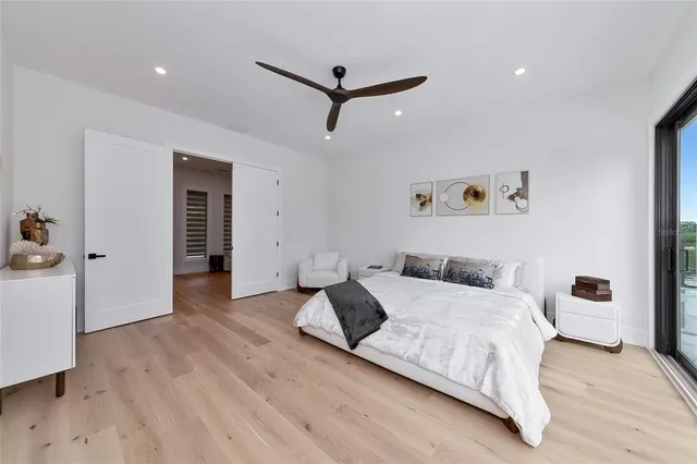 a bathroom with a double vanity sink mirror and bathtub