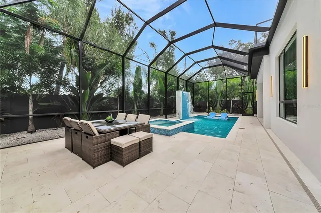 a view of a patio with a table and chairs
