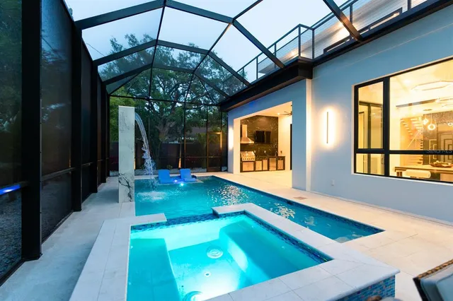 a view of a backyard with a small cabin and a chair