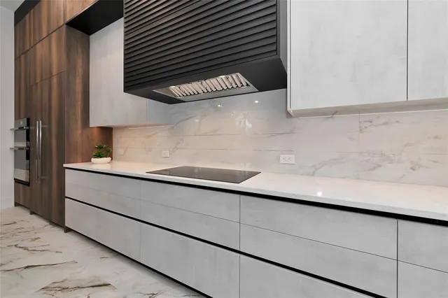 a kitchen with a sink and cabinets