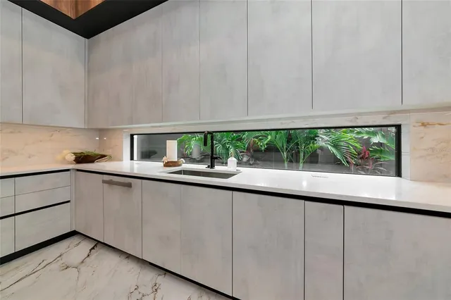 a living room with a large bed and a flat screen tv