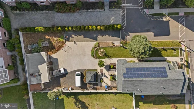 an aerial view of a house with a swimming pool