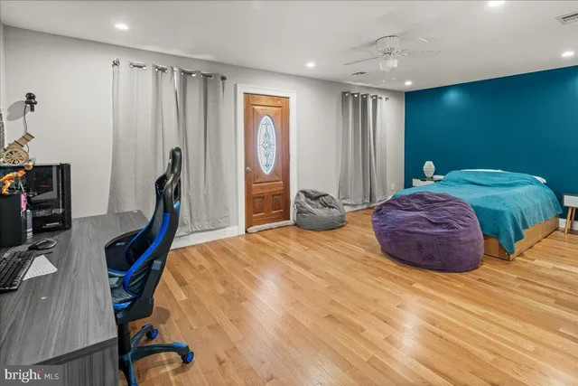 a kitchen with stainless steel appliances granite countertop a stove top oven island a refrigerator and a sink