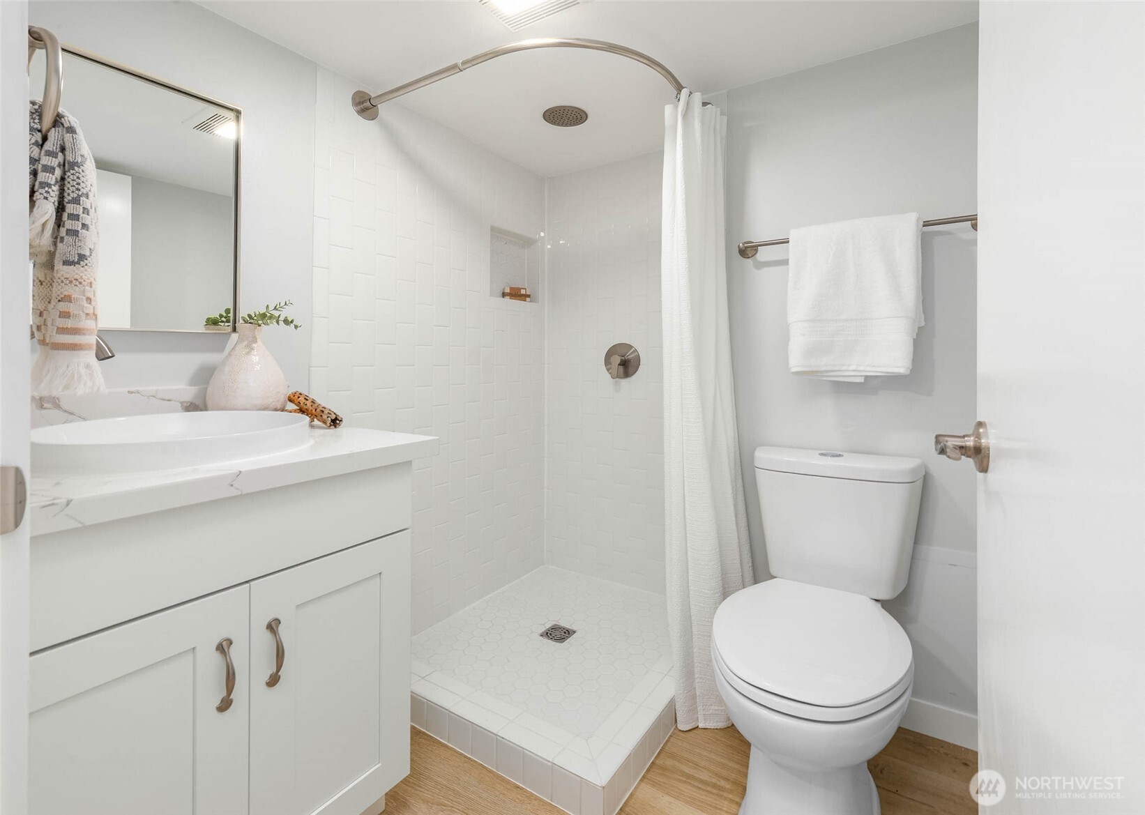 1312 Northeast 70th Street Seattle, WA 98115 - Photo 23 of 36 a bathroom with a sink toilet and shower