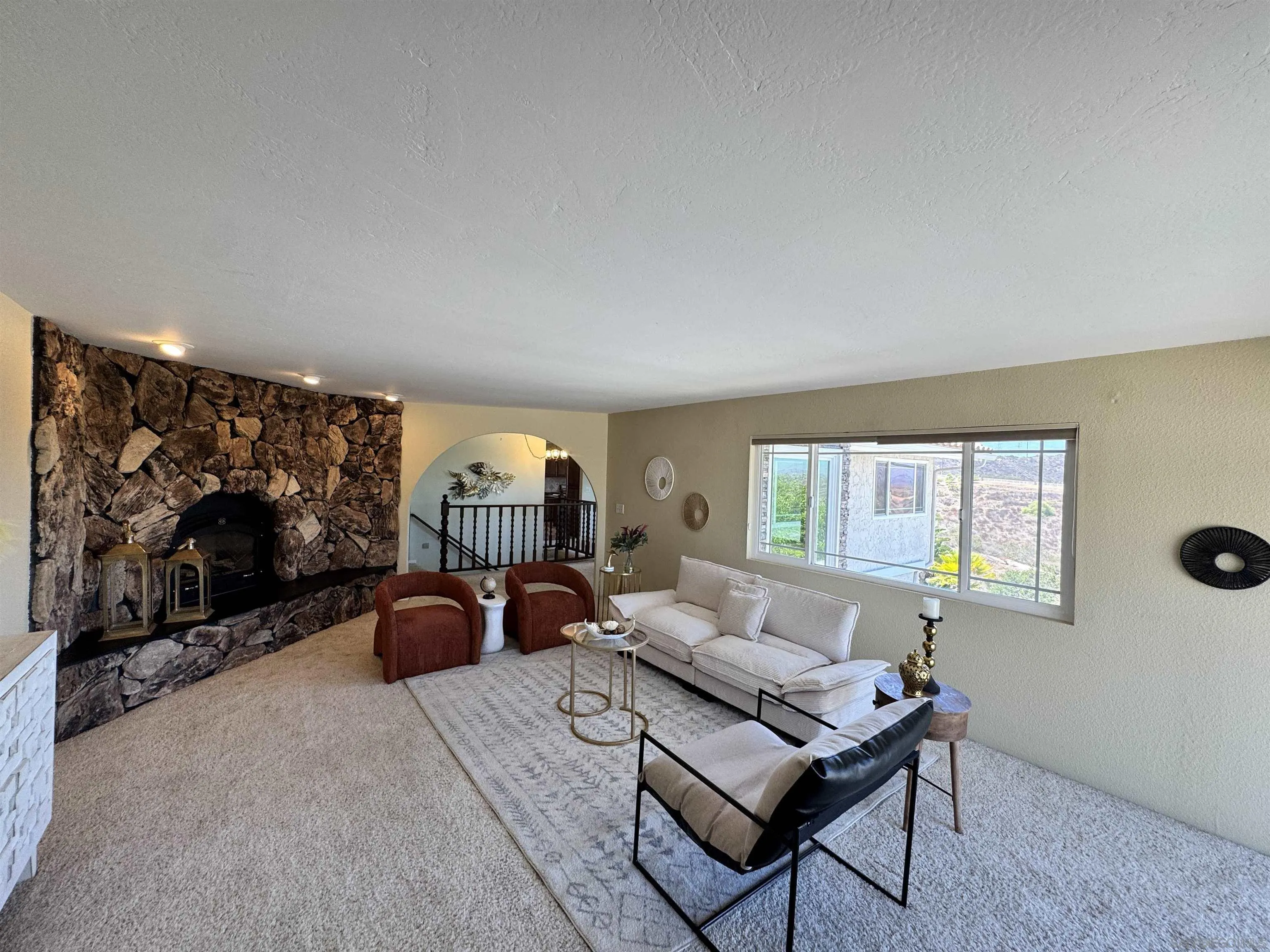 3049 Millar Ranch Road Spring Valley, CA 91978 - Photo 11 of 71 a living room with furniture a rug and a flat screen tv