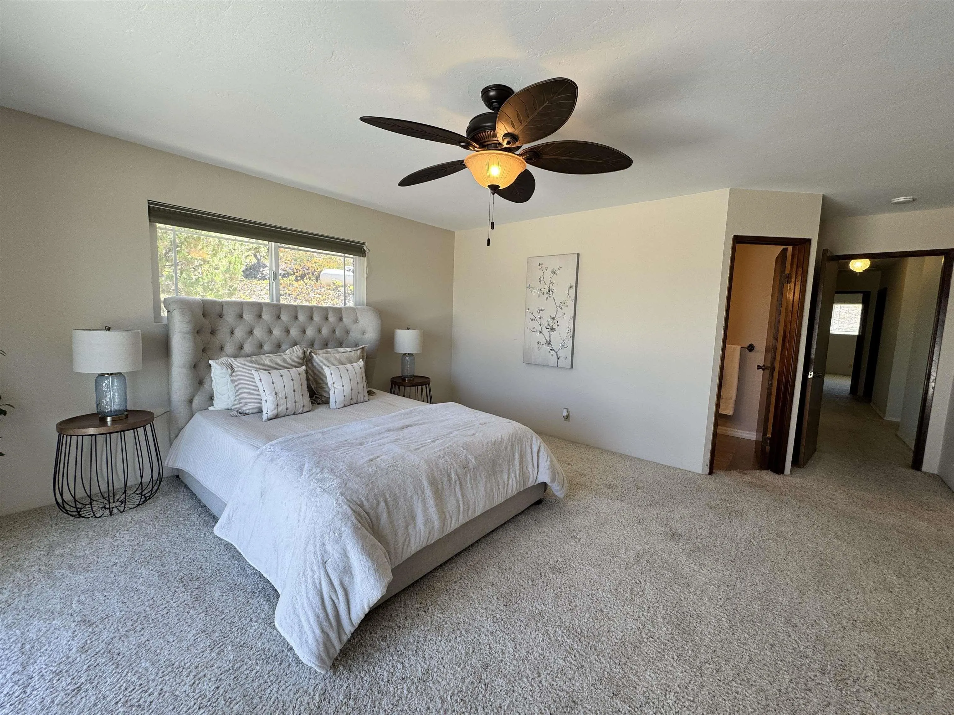 3049 Millar Ranch Road Spring Valley, CA 91978 - Photo 25 of 71 a bedroom with a bed and a chandelier