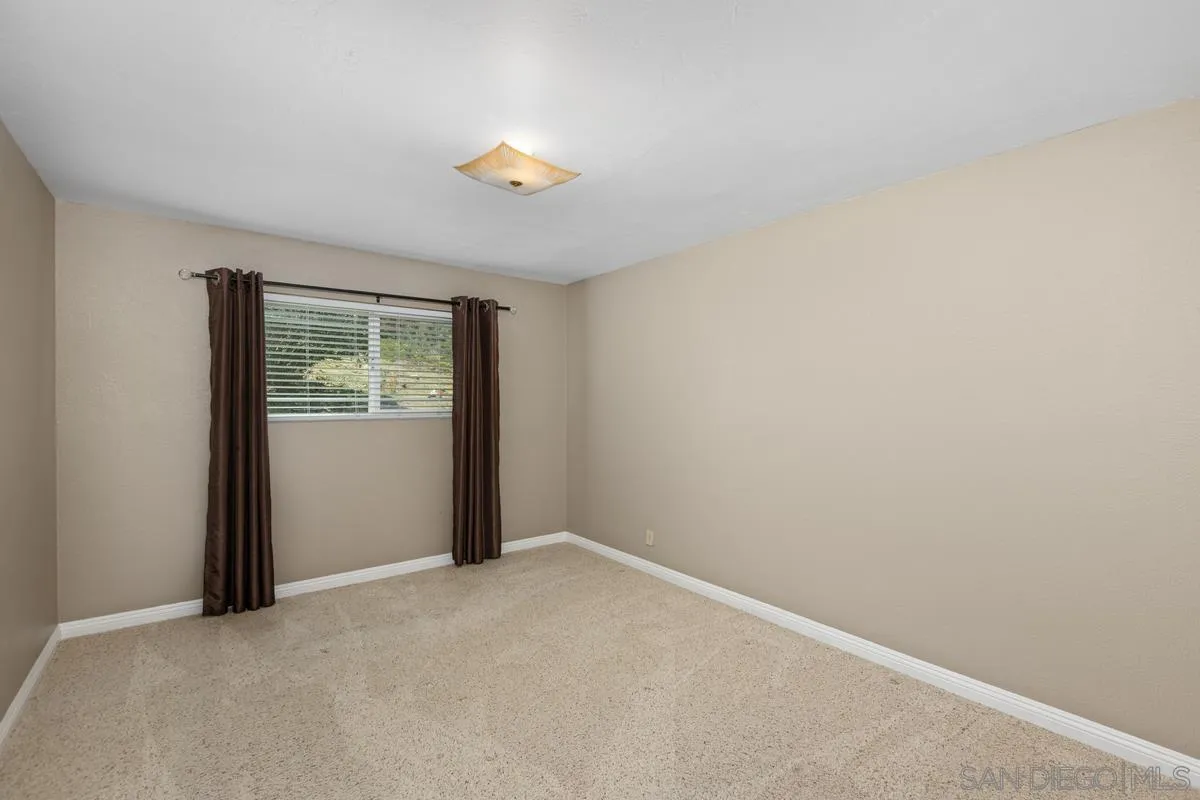 3049 Millar Ranch Road Spring Valley, CA 91978 - Photo 37 of 71 an empty room with windows