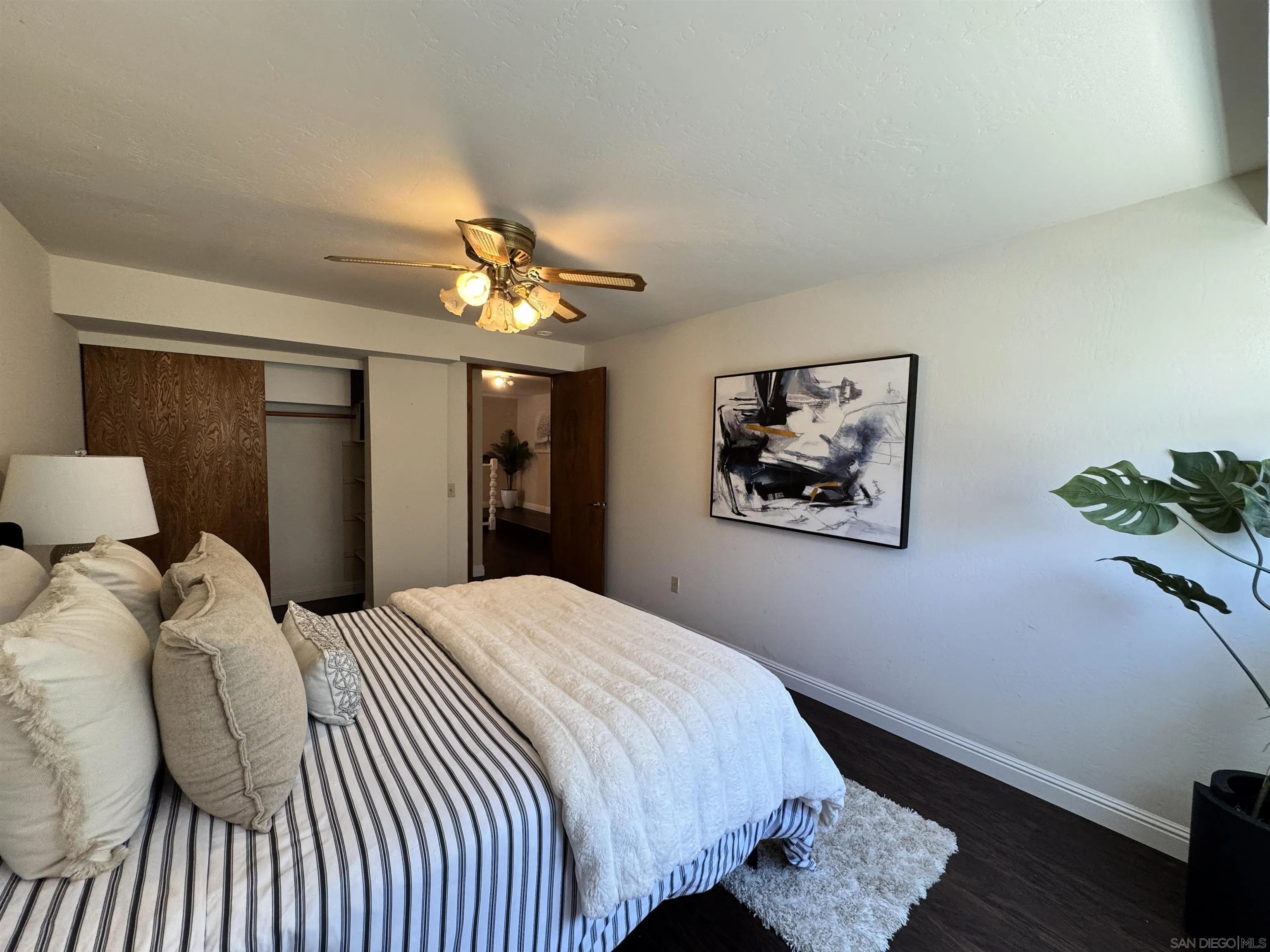 3049 Millar Ranch Road Spring Valley, CA 91978 - Photo 8 of 71 a bedroom with a bed and a painting on the wall