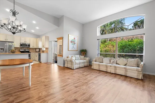 a spacious bathroom with double vanity and a mirror