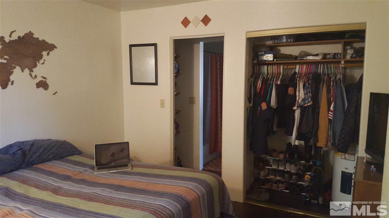 1120 Jones Street Reno, NV 89503 - Photo 20 of 25 a bedroom with a bed and a mirror