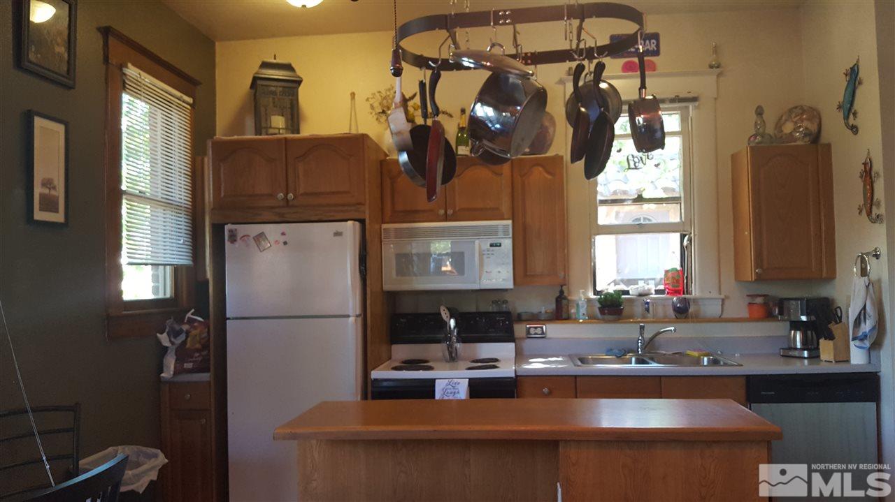 1120 Jones Street Reno, NV 89503 - Photo 6 of 25 a kitchen with a refrigerator and a sink
