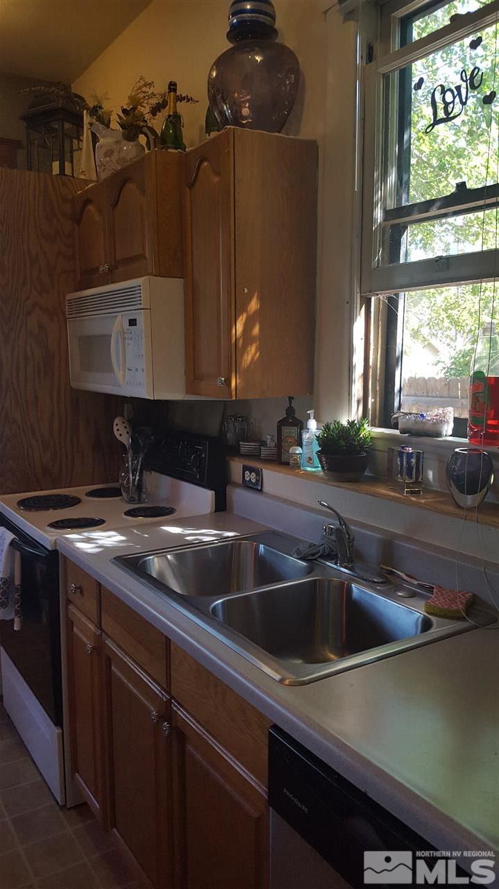 1120 Jones Street Reno, NV 89503 - Photo 8 of 25 a kitchen that has a sink and a stove