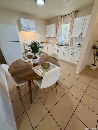 a view of kitchen with furniture and wooden floor