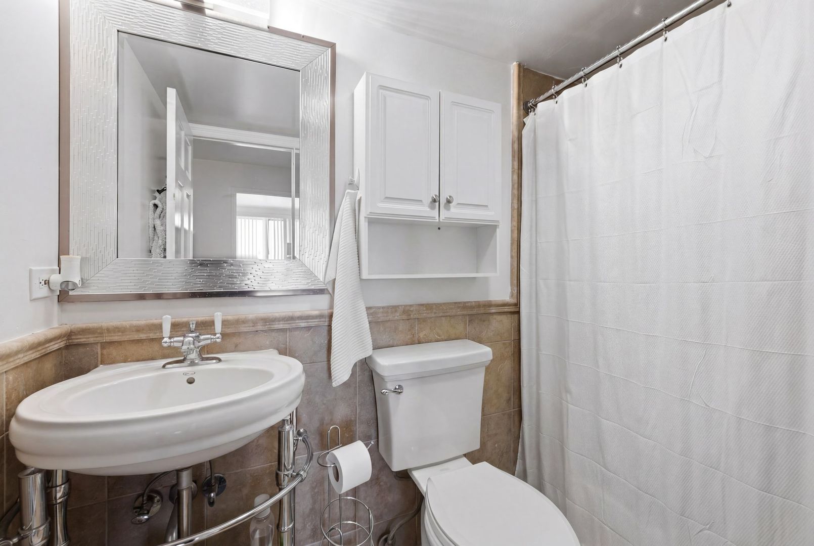 1 Renaissance Place, Unit 816 Palatine, IL 60067 - Photo 19 of 23 a bathroom with a sink a toilet and a mirror