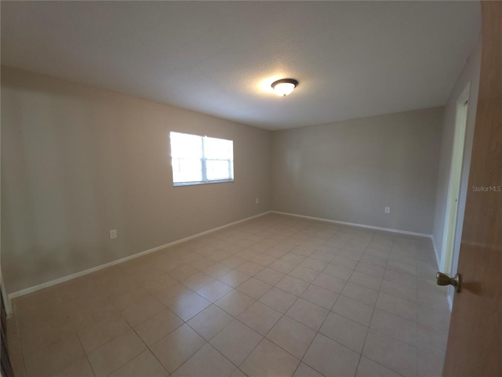 4204 East Okara Road Tampa, FL 33617 - Photo 14 of 21 an empty room with windows