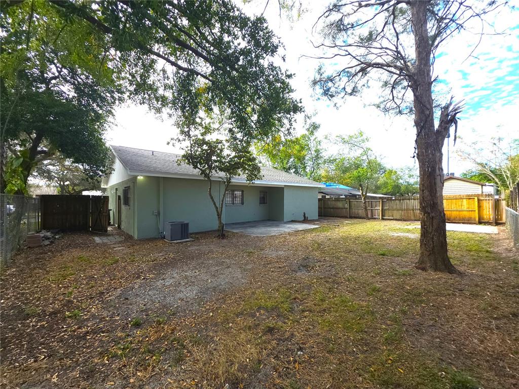 4204 East Okara Road Tampa, FL 33617 - Photo 21 of 21 a house with trees in front of it