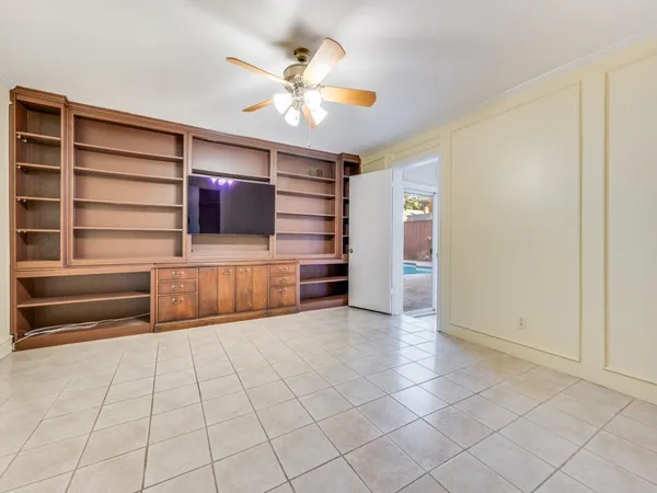 a view of a livingroom with furniture and staircase