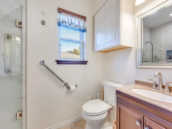 a bathroom with a sink toilet and vanity