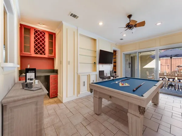 a living room with furniture a rug and a flat screen tv