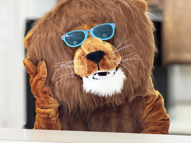 a kitchen with a sink and a mirror