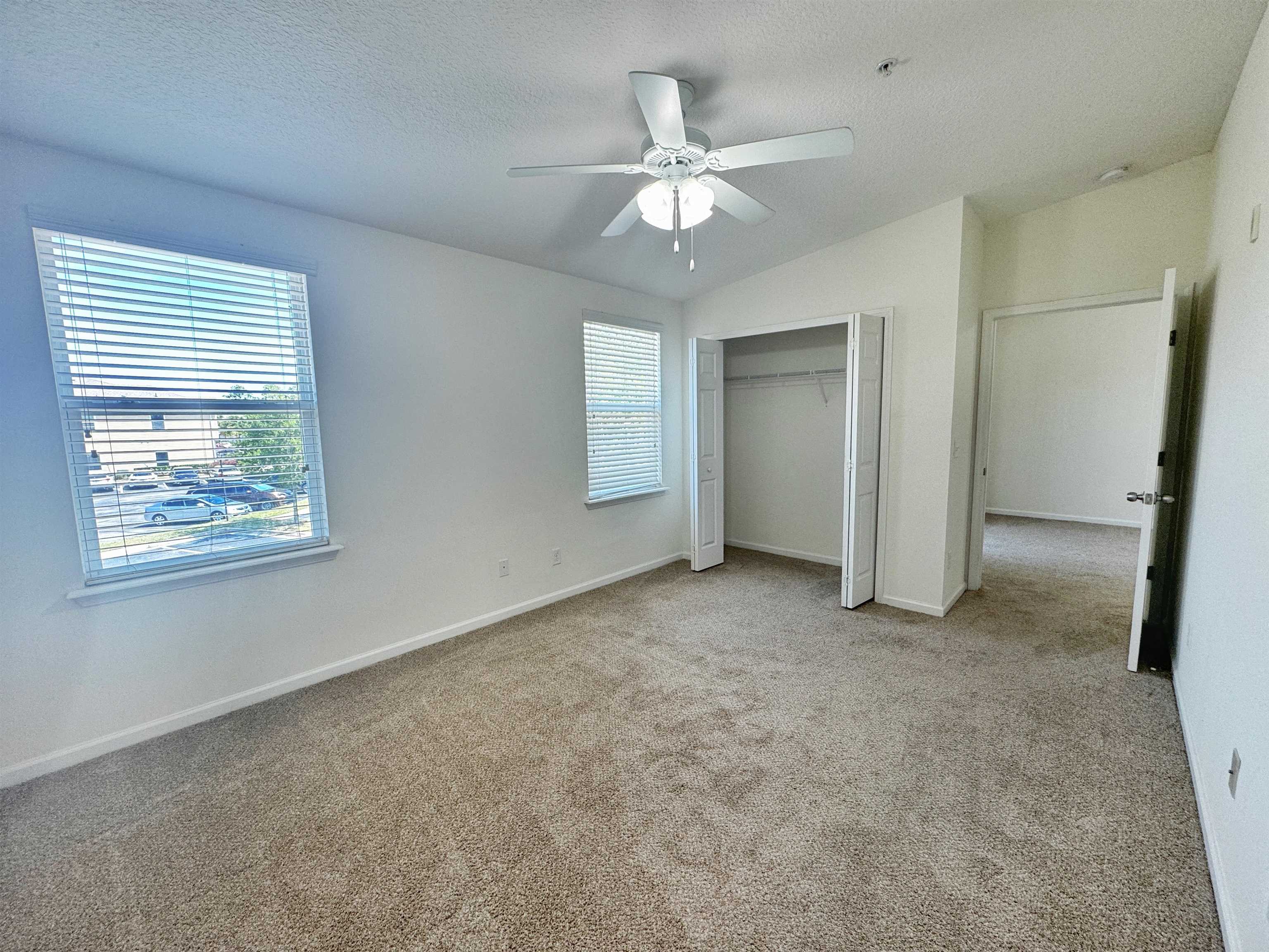 2261 Golden Lake Loop St. Augustine, FL 32084 - Photo 22 of 43 an empty room with fan and windows