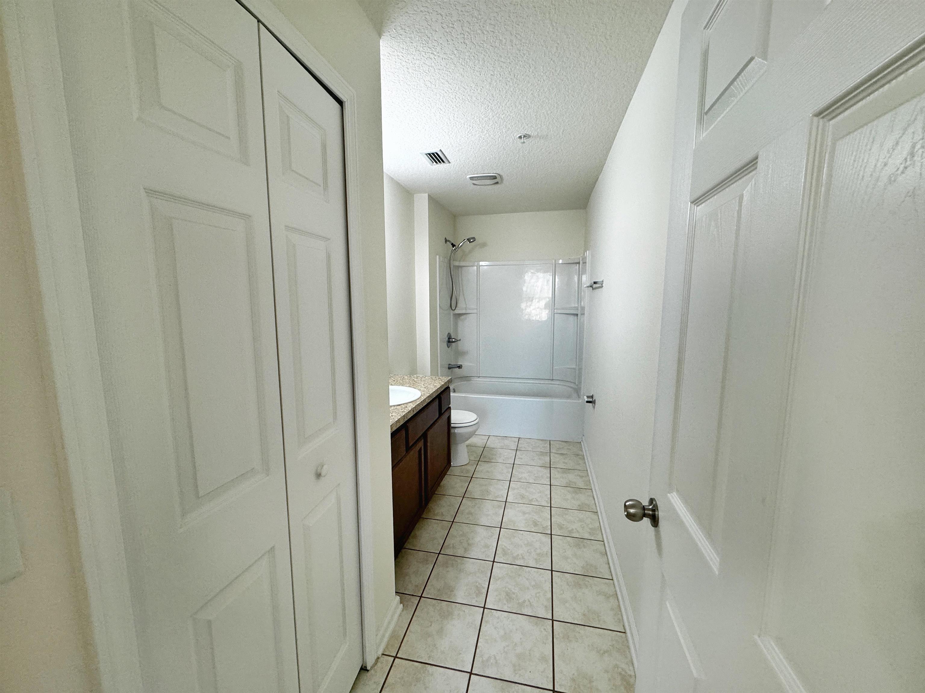 2261 Golden Lake Loop St. Augustine, FL 32084 - Photo 23 of 43 a bathroom with a bathtub and a shower