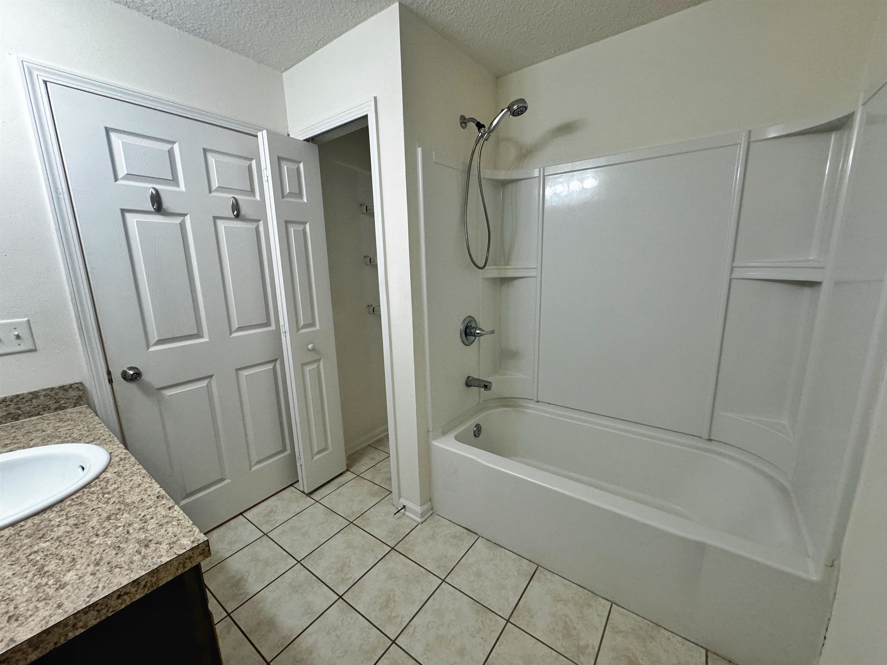 2261 Golden Lake Loop St. Augustine, FL 32084 - Photo 35 of 43 a bathroom with a granite countertop sink toilet and shower