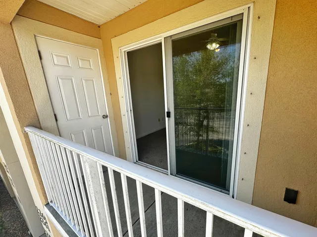 a view of house with a roof deck