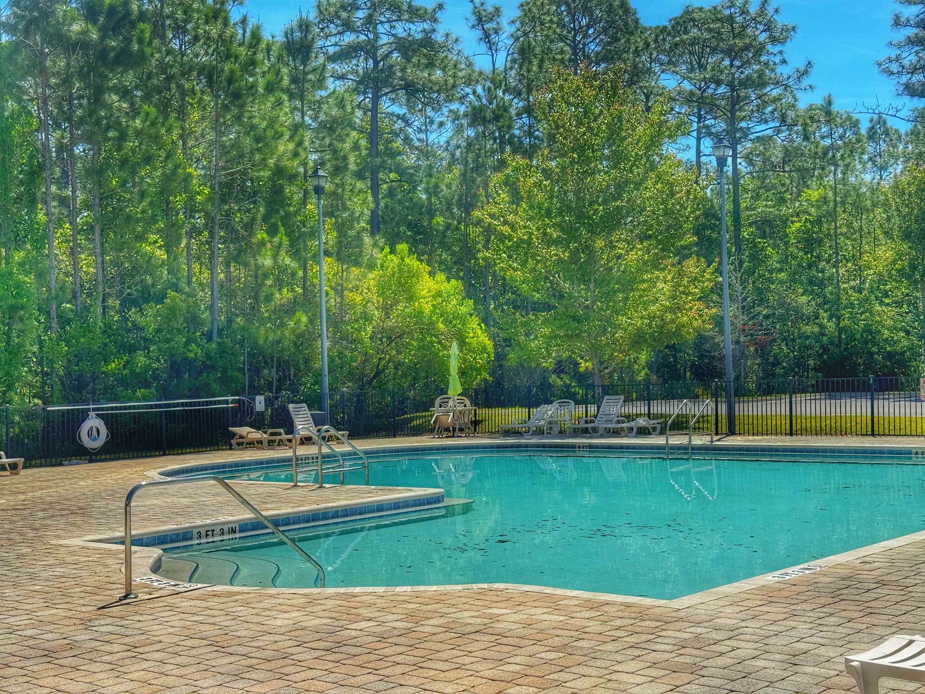 2261 Golden Lake Loop St. Augustine, FL 32084 - Photo 41 of 43 a view of a swimming pool with a yard
