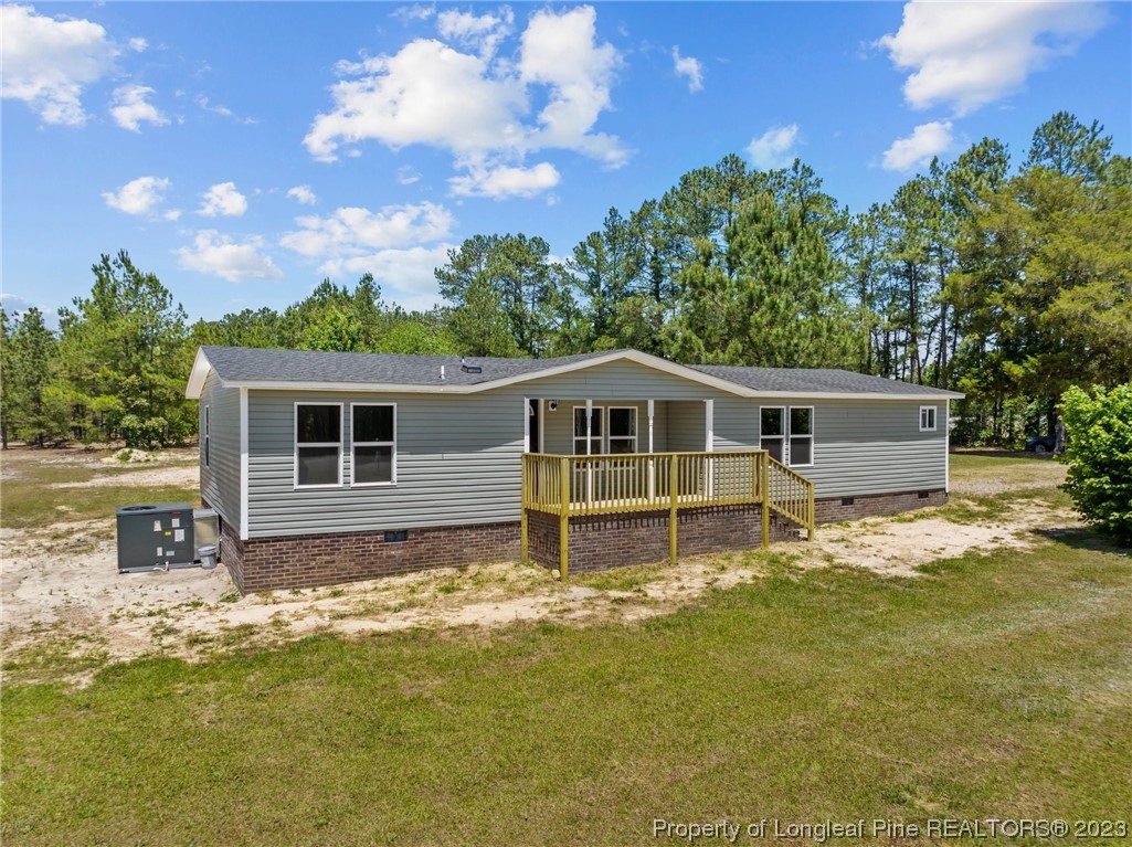 1770 Ashemont Road Aberdeen, NC 28315 - Photo 1 of 29 a house view with a garden space