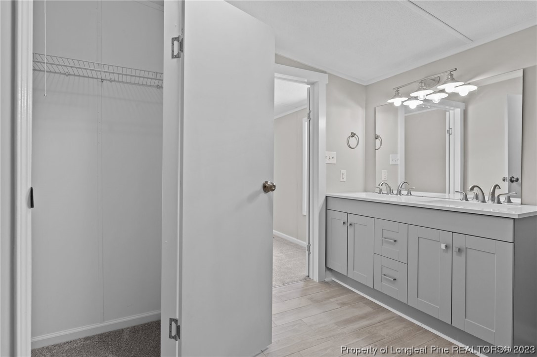 1770 Ashemont Road Aberdeen, NC 28315 - Photo 14 of 29 a bathroom with a granite countertop sink mirror and a